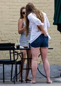 Sexy girl in a tiny grey skirt with decent ass