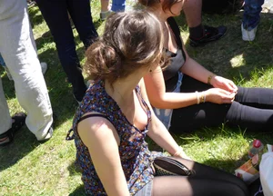 2 sexy girls showing nice cleavage while sitting together