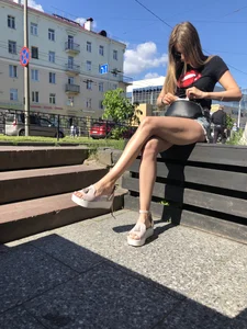 Girl in Denim Shorts with Amazing Hot Legs Fixing Her Sandals Street Candid Photo Gallery