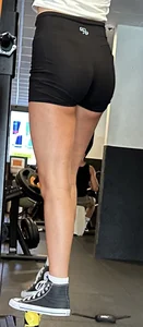 Hot tanned girl in gym with amazing legs and tight ass