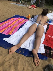 Series of Photos of Sexy Girls in Swimsuits Lying on a Beach With Slightly Spread Legs