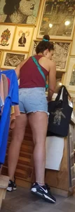 Laughing girl in shorts, legs and thick peach