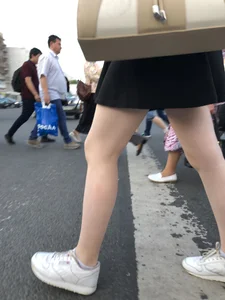 Candid girl wearing a short skirt crossing the street, awesome pale legs