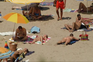Girls on a nude beach in Sitges, Spain
