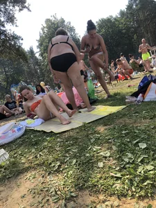 Sexy Girl in Swimsuit Sitting on a Beach With Her Phone Creepshots Gallery