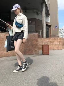 Cute candid teen with pale slim legs in shorts