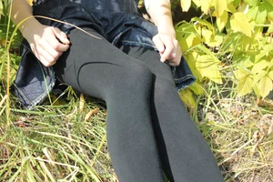 Teen JB Sitting in the Grass in a Skirt and Black Tights