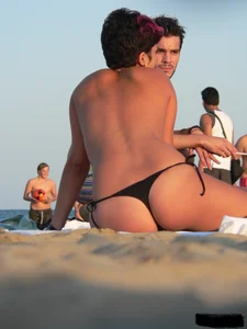 Sexy girls going topless at the beach showing off their sexy bodies