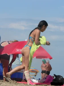 Couple of thick beach teens in little thong bikinis