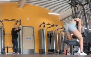 Gym brunette in tight grey shorts
