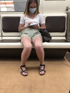 Girl in Shorts, Sandals and a Mask With Hot Legs in the Subway Train Creepshots