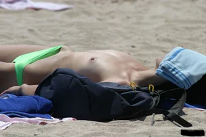 Beach voyeur girls in bikinis, thongs and topless