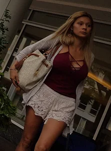 Cute girl with big boobs in loose white shorts