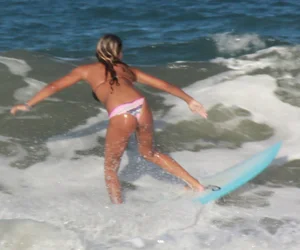 Hot surfer chicks out in the water
