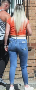 Blonde in skintight jeans shopping with boyfriend