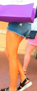 Candid girl in denim shorts with nice legs and showing her cheeks