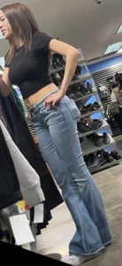 Petite Asian ho showing off tramp stamp & bubble butt