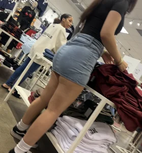 Cute salesgirl with tight Jean skirt showing some legs (OC)