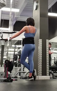 Bending gym babe stern face