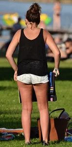Sexy blonde girl in the park playing volleyball in her skimpy bikini