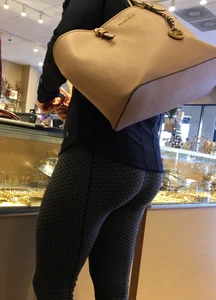 Brunette jewelry shopping in leggings with a nice ass