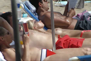 Girls on a nude beach in Sitges, Spain