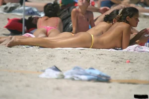 Sexy candid topless and nude beach girls