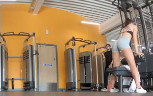 Gym brunette in tight grey shorts