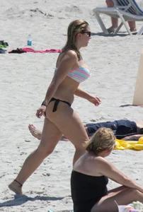 Big boobed thick blonde on the beach in a bikini