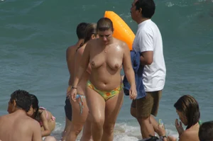Topless girls on a beach in Barcelona