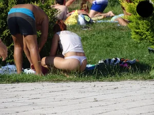 Hot chick with a nice ass at the pool in a white see through thong