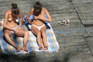 Two teens stripping and going topless to tan