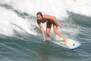 Candid surfer babes on the beach and in bikinis
