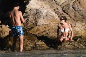 Iris Mittenaere in a white thong bikini on the beach in St Martin