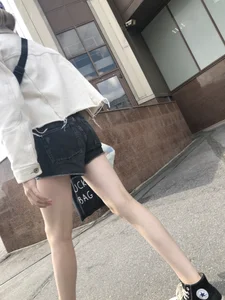 Cute candid teen with pale slim legs in shorts