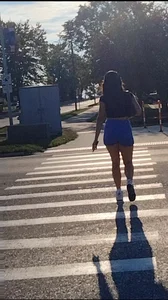 Sexy Candid Girl in a Top And Blue Shorts Walking Down the Street Creepshots Gallery