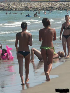 Bunch of sexy babes at the beach in thong bikinis