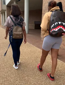 Friends in spandex grey bike shorts and tight jeans