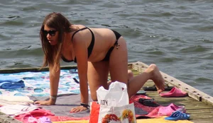 Thick babe with big boobs in a black bikini