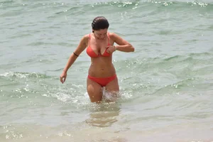 Two sexy ass girls on the beach in bikinis