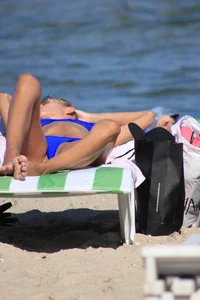 A couple sexy girls laying out on the beach