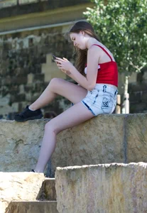 Pretty candid girls with nice legs sitting in denim shorts