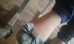 College girls' feet under table