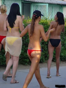 Beach voyeur girls in bikinis, thongs and topless