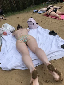 Wet Candid Girl in Swimsuit Lying on Towel on Her Stomach at the Beach With Dirty Feet Creepshots Gallery