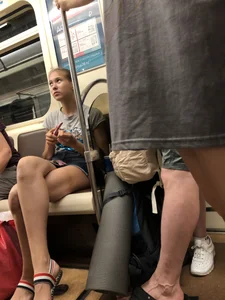 Tall Candid Teen Girl in Denim Shorts And Sandals Sitting in the Subway Train, Then Walking Down the Station