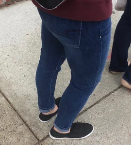 2 nice asses in tight jeans standing around