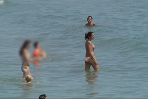 Girls on a nude beach in Sitges, Spain