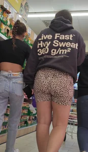 Thick brunette in short leggings and company