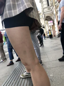 Closeups of a gorgeous girl wearing spandex mini shorts crossing the street